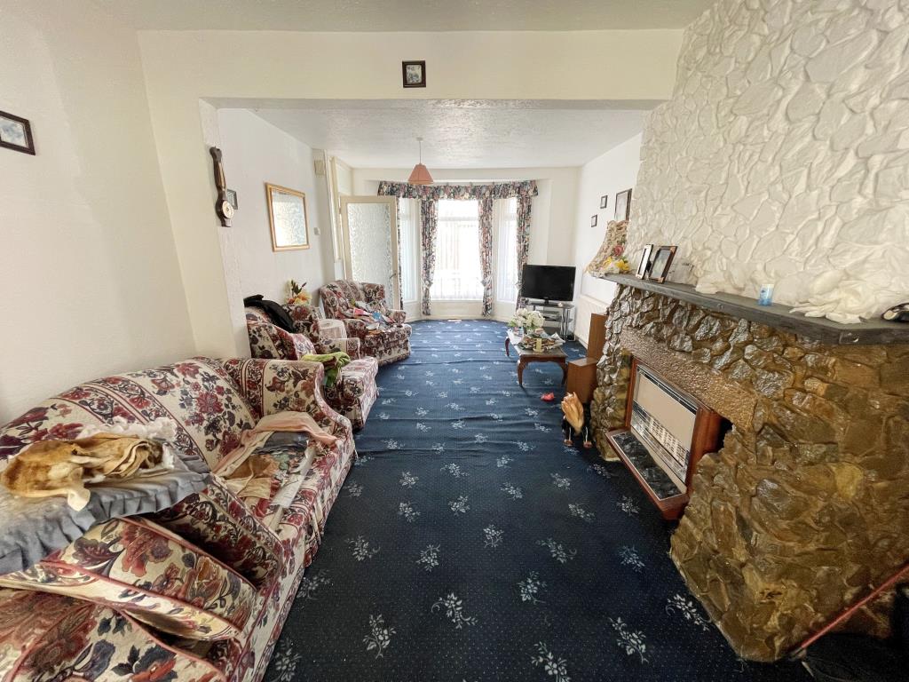 Lot: 111 - TWO-BEDROOM HOUSE FOR REFURBISHMENT - Living room with bay window